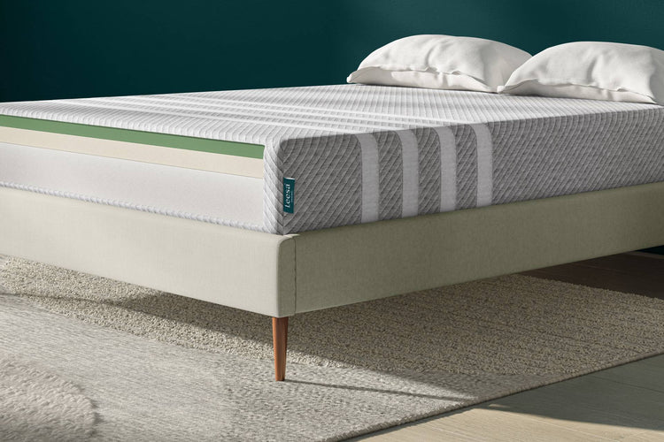Mattress with layered comfort foams on a light upholstered bed frame