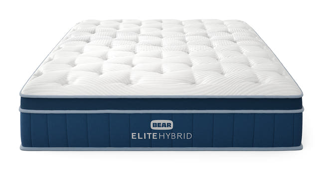 Bear Elite Hybrid mattress front three-quarter view with tufted white pillow top and navy foundation for The Mattress Shop, showcasing product image Bear Elite Hybrid on the page: Best Mattresses 2026 page.