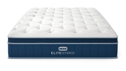 Bear Elite Hybrid mattress front three-quarter view with tufted white pillow top and navy foundation