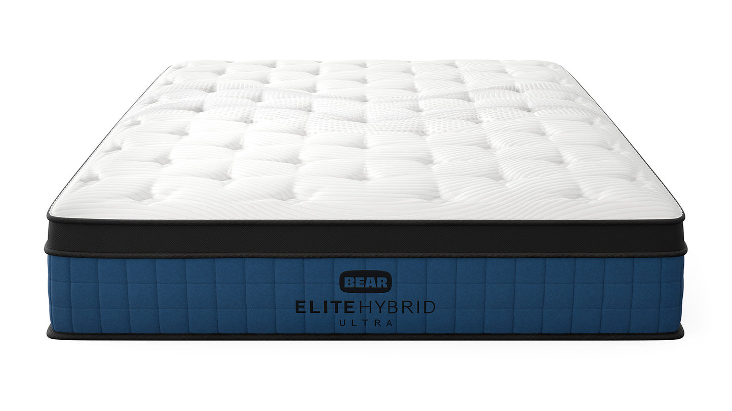 Bear Mattress Elite Ultra Hybrid angled product view showing quilted pillow top and navy blue base for The Mattress Shop, showcasing product image for Bear Elite Ultra Hybrid on the product page.