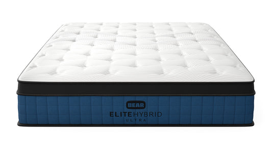 Bear Mattress Elite Ultra Hybrid angled product view showing quilted pillow top and navy blue base for The Mattress Shop, showcasing product image for Bear Elite Ultra Hybrid on the collection page.