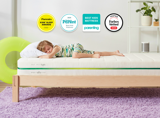 A rendered image of the Helix Kids mattress in a bedroom scene. 