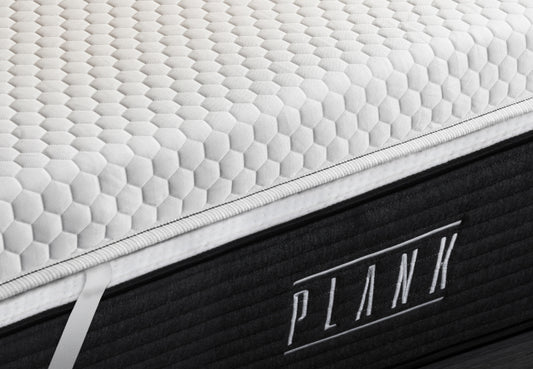 Plank Firm Topper zoom showcasing its pressure-relieving foam and enhanced support for firmer sleep surface. for The Mattress Shop, showcasing product image for Brooklyn Bedding Plank Firm Topper on the collection page.