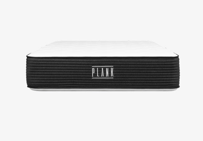 Brooklyn Bedding Plank Luxe mattress front view with black ribbed sides and white top on white background for The Mattress Shop, showcasing product thumbnail image for Brooklyn Bedding Plank Firm Luxe on the product page.