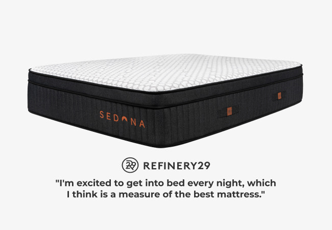 Brooklyn Bedding Sedona Elite mattress angled view with black ribbed sides, white pillow top, Refinery29 recommended for The Mattress Shop, showcasing product image Brooklyn Bedding Sedona Elite on the page: Best Hybrid Mattresses page.