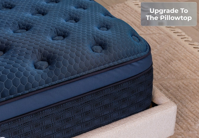 Brooklyn Bedding Signature mattress navy blue tufted pillow top close-up, upgrade to the pillowtop. for The Mattress Shop, showcasing product image for Brooklyn Bedding Signature Hybrid on the product page.