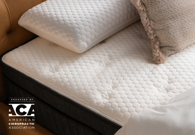 Brooklyn Bedding Titan Plus Luxe cooling comfort mattress surface with quilted pressure-relief top designed for supportive sleep. for The Mattress Shop, showcasing product image Brooklyn Bedding Titan® Plus Luxe on the page: Best Hybrid Mattresses page.