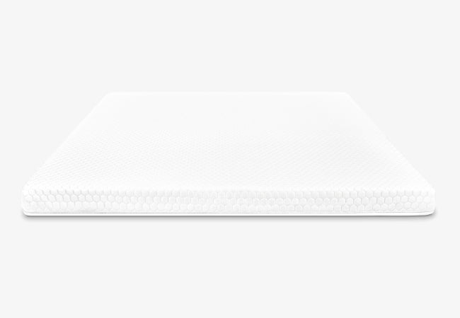 Brooklyn Bedding microcoil mattress topper side profile view designed for optimal comfort and pressure relief for The Mattress Shop, showcasing product image for Brooklyn Bedding Microcoil Mattress Topper on the product page.
