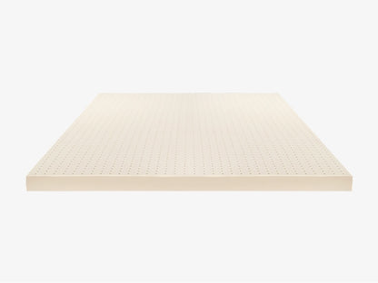 Brooklyn Bedding Talalay latex mattress topper side profile view with pinhole aeration on white background