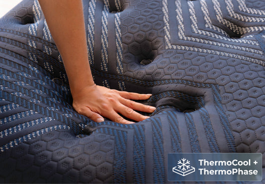 Brooklyn Bedding ThermoBalance Elite close-up with hand pressing in, featuring ThermoCool and ThermoPhase. for The Mattress Shop, showcasing product image for Brooklyn Bedding ThermoBalance Elite on the collection page.