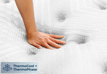 Brooklyn Bedding ThermoBalance LX close-up with hand pressing into white pillow top, ThermoCool and ThermoPhase