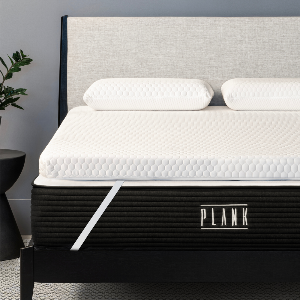 Plank Firm Topper with a lifestyle image showing its comfortable, supportive design for restful sleep.