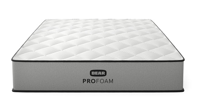 Bear Pro Foam mattress three-quarter front view with white quilted top and gray ribbed foundation for The Mattress Shop, showcasing product thumbnail image for Bear Pro Foam on the product page.