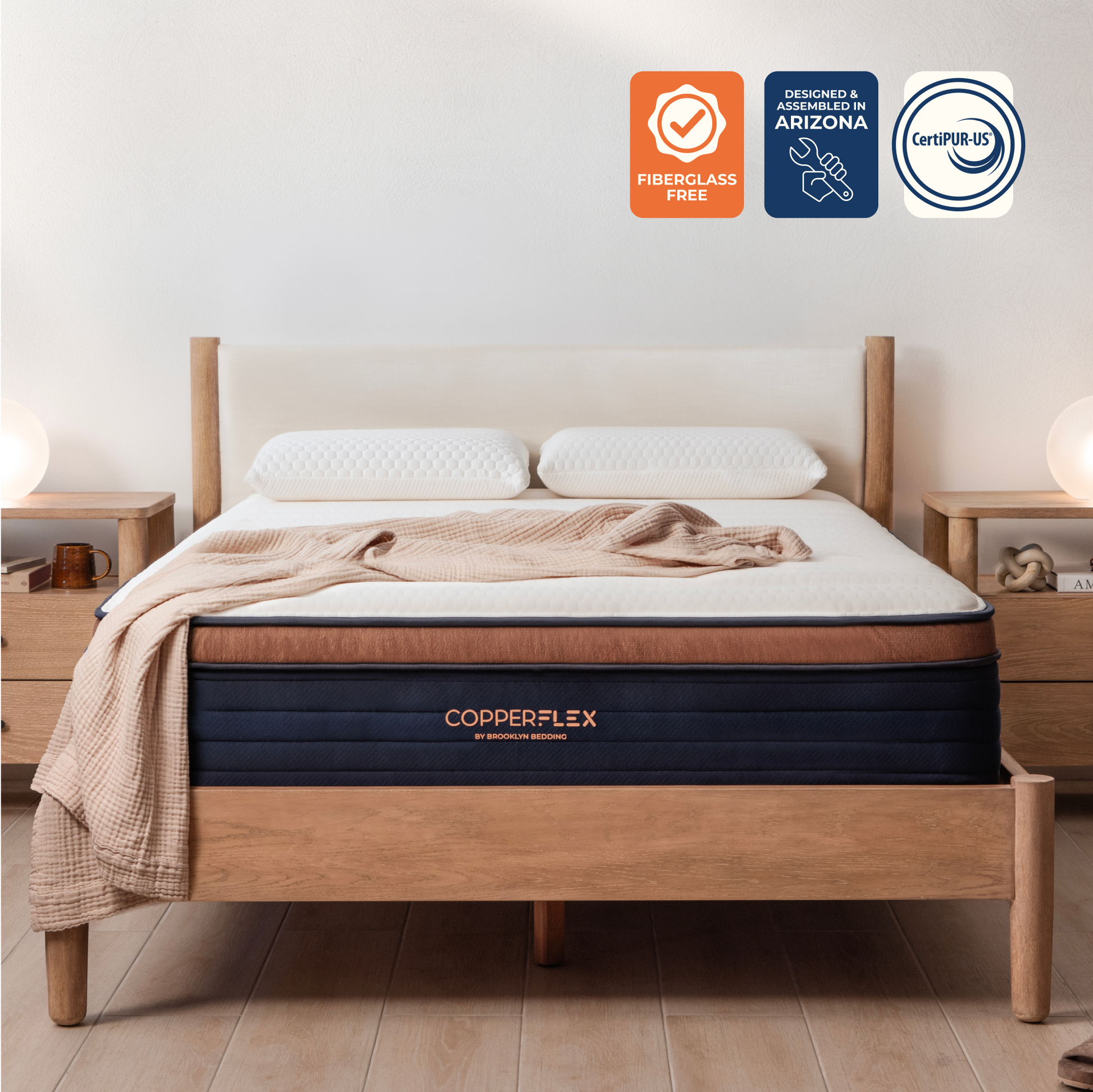 CopperFlex mattress on a wooden bed frame with CertiPUR-US, assembled in Arizona and Fiberglass-Free logos.