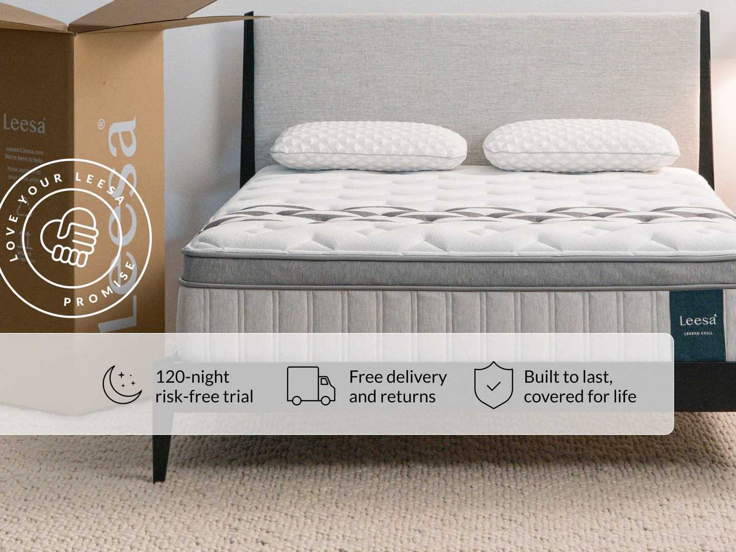 Leesa Legend Chill mattress on gray bed frame with pillows, shipping box shows Love Your Leesa Promise guarantee. for The Mattress Shop, showcasing product image for Leesa Legend Chill Hybrid Mattress on the product page.