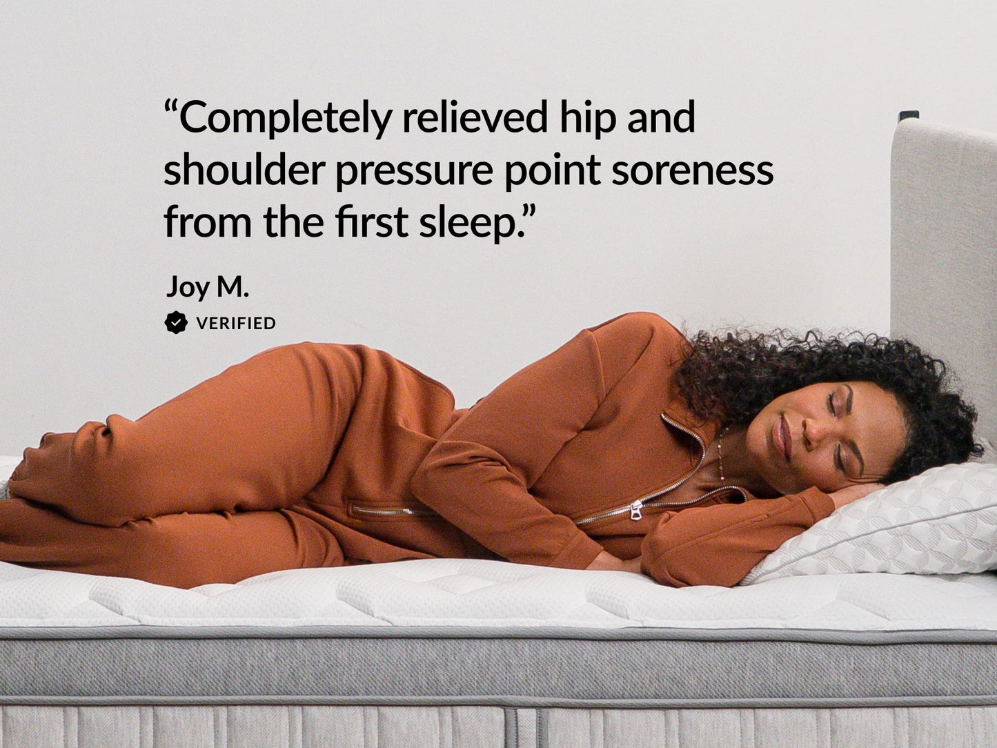 Woman sleeping on Leesa Legend Chill mattress, verified review on relieving hip and shoulder pressure soreness. for The Mattress Shop, showcasing product image for Leesa Legend Chill Hybrid Mattress on the product page.