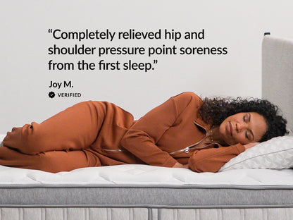 Woman sleeping on Leesa Legend Chill mattress, verified review on relieving hip and shoulder pressure soreness.