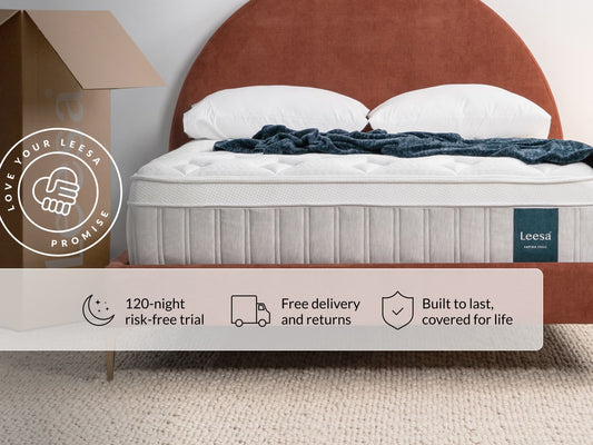 Leesa Sapira Chill mattress on bed with pillows and throw blanket, shipping box shows Love Your Leesa Promise. for The Mattress Shop, showcasing product image for Leesa Sapira Chill Hybrid Mattress on the collection page.