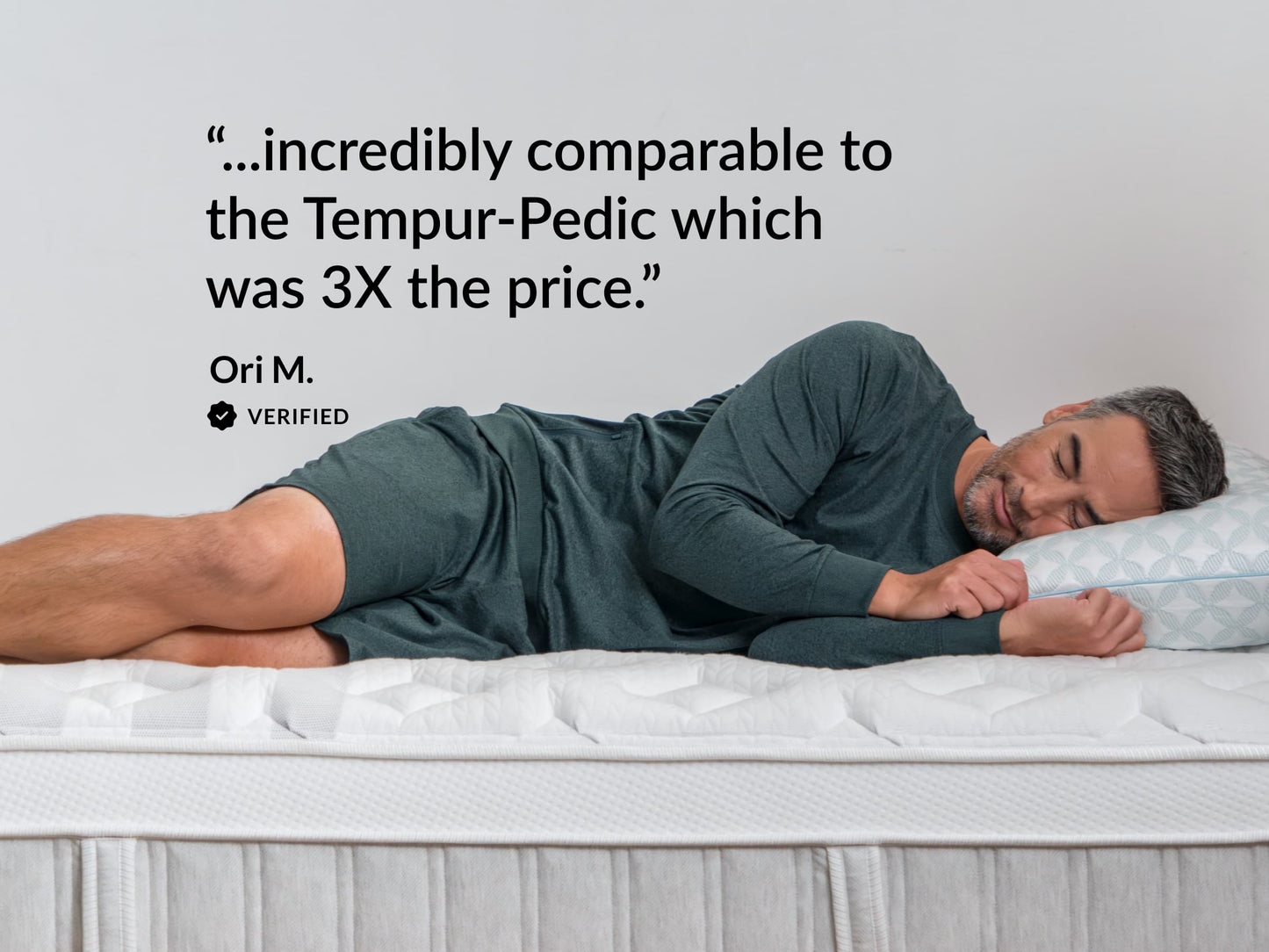 Man sleeping peacefully on Leesa mattress, with verified review comparing comfort favorably to pricier Tempur-Pedic. for The Mattress Shop, showcasing product image for Leesa Sapira Chill Hybrid Mattress on the product page.