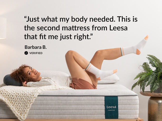 Woman relaxing on Leesa Studio Chill mattress, verified review calling it the second Leesa mattress that fit just right. for The Mattress Shop, showcasing product thumbnail image for Leesa Studio Chill Hybrid Mattress on the product page.