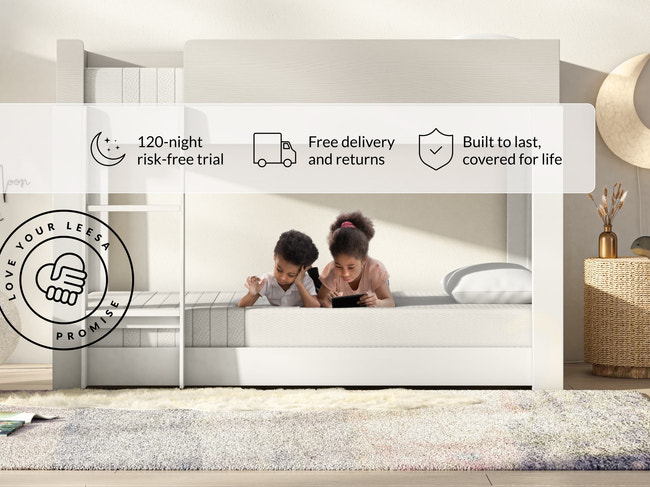 Two kids lying on Leesa Kids mattress in bunk bed, shipping details show Love Your Leesa Promise guarantee. for The Mattress Shop, showcasing product image Leesa Kids Mattress on the page: Best Mattresses for Kids page.