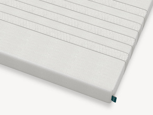 Corner detail of Leesa Kids mattress showing chevron-textured cover and brand label. for The Mattress Shop, showcasing product image for Leesa Kids Mattress on the collection page.