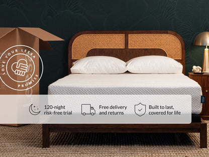 Leesa Legend Hybrid mattress on rattan bed frame with pillows, shipping box shows Love Your Leesa Promise.