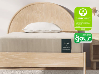 Leesa + West Elm Natural Essential mattress on an arched oak bed frame, certified GREENGUARD Gold and GOLS