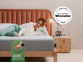 Woman lying on Leesa Original mattress with tufted orange headboard, earning NYT Wirecutter's 2026 Our Pick award. for The Mattress Shop, showcasing product image Leesa Original Mattress on the page: Sale Landing page.