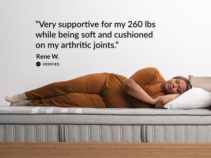 Woman sleeping on Leesa Plus Hybrid mattress, verified review on support and cushioning for arthritic joints.