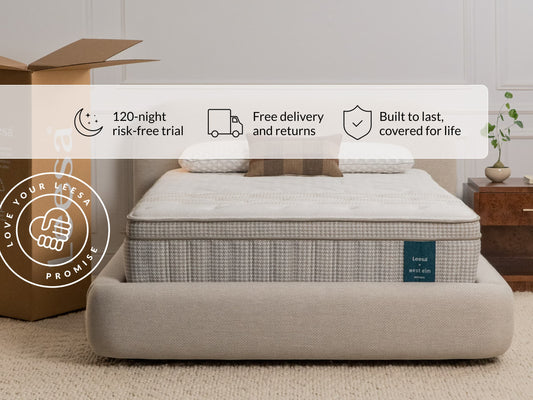 Leesa Legend Hybrid mattress on rattan bed frame with pillows, shipping box shows Love Your Leesa Promise. for The Mattress Shop, showcasing product image for Leesa Reserve Hybrid Mattress on the collection page.