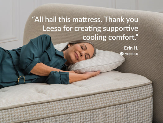 Woman sitting against Leesa Legend Hybrid mattress, Sleep Foundation quote on impressive luxury hybrid design. for The Mattress Shop, showcasing product image for Leesa Reserve Hybrid Mattress on the collection page.