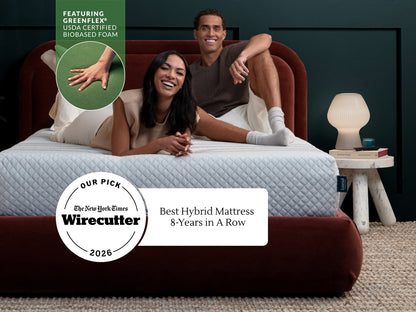 Couple laughing on Leesa Sapira Hybrid mattress, NYT Wirecutter's Best Hybrid Mattress pick 8 years running.