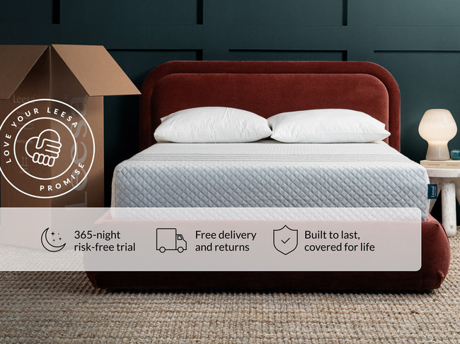 Leesa Sapira Hybrid mattress on red velvet bed frame with pillows, shipping box shows Love Your Leesa Promise. for The Mattress Shop, showcasing product image Leesa Sapira Hybrid Mattress on the page: Best Mattresses 2026 page.