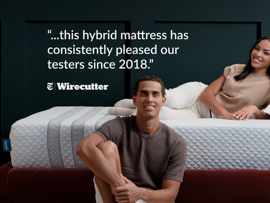 Couple relaxing on Leesa Sapira Hybrid mattress, Wirecutter quote on pleasing testers consistently since 2018. for The Mattress Shop, showcasing product image for Leesa Sapira Hybrid Mattress on the collection page.
