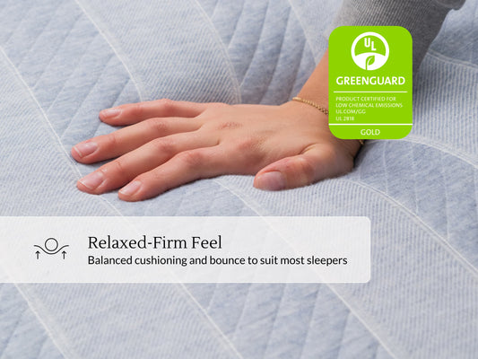Hand resting on Leesa Studio mattress cover, UL Greenguard Gold certified with relaxed-firm feel. for The Mattress Shop, showcasing product image for Leesa Studio Mattress on the collection page.