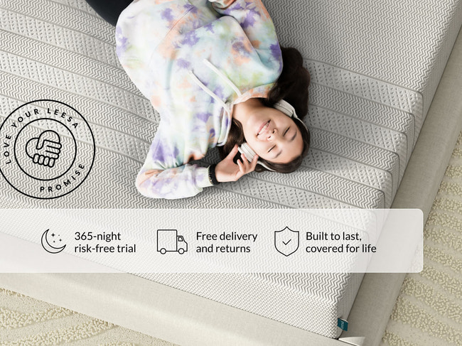 Teen in tie-dye hoodie and headphones relaxing on a Leesa mattress; 365-night trial, free delivery, lifetime coverage for The Mattress Shop, showcasing product image Leesa Youth Mattress on the page: Best Mattresses for Kids page.