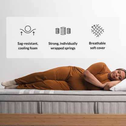 Woman on the Leesa Plus Hybrid Mattress in a bedroom.