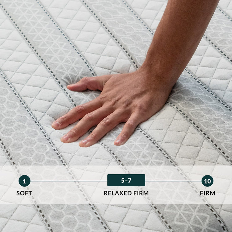 Hand touching the Leesa Sapira Hybrid Mattress.