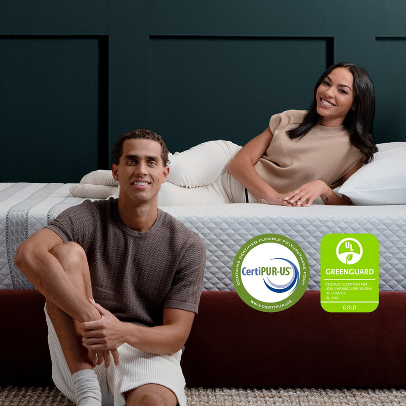 Couple on the Leesa Sapira Hybrid Mattress in a bedroom.