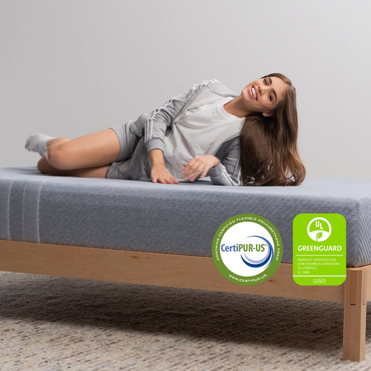 Woman on the Leesa Studio Mattress in a bedroom. for The Mattress Shop, showcasing product image for Leesa Studio Mattress on the collection page.