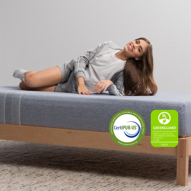 Woman on the Leesa Studio Mattress in a bedroom. for The Mattress Shop, showcasing product thumbnail image for Leesa Studio Mattress on the product page.