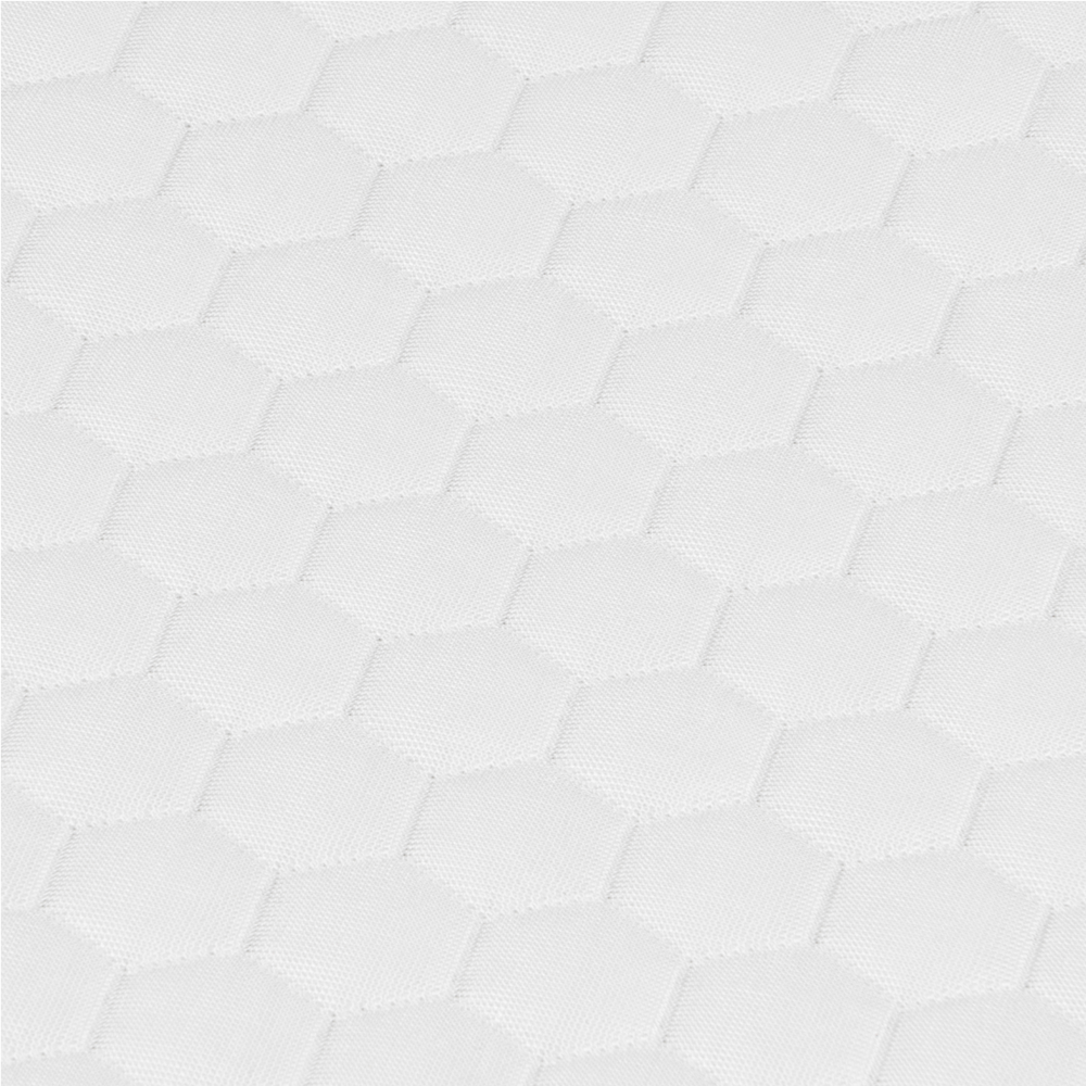 Close-up of white mattress cover with breathable hexagonal quilted fabric texture.